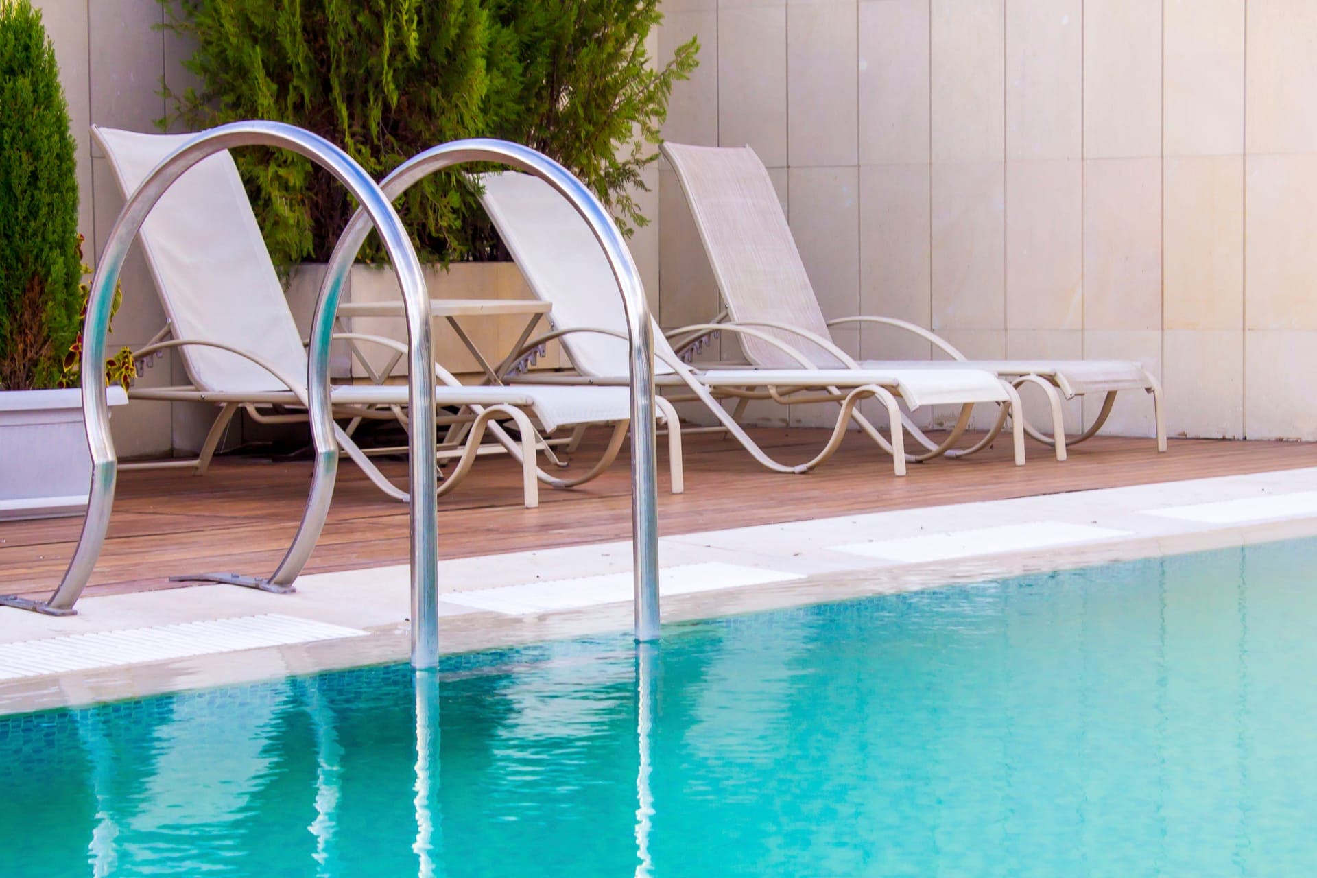 Poolside lounge area at a completed Paragon Pool & Spa installation